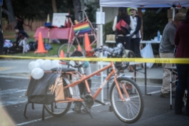 Tall "Frankenbike" (in background with rainbow flag) belonging to Ginger Jui of Bike East Bay, who came out to Concord with two of her colleagues to join us at Tamale Fest. The orange Yuba cargo bike in the foreground is a donation to Bike Concord by member Sarah Allen, and is now in service as a loaner to families.